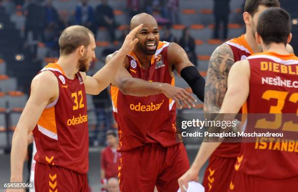 Players of Galatasaray celebrate their victory during the 2016/2017 Turkish Airlines EuroLeague Regular Season Round 26 game between Olympiacos...