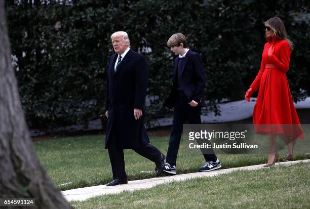President Donald Trump, son Barron Trump and First Lady Melania Trump prepare to depart the White House on March 17, 2017 in Washington, DC....