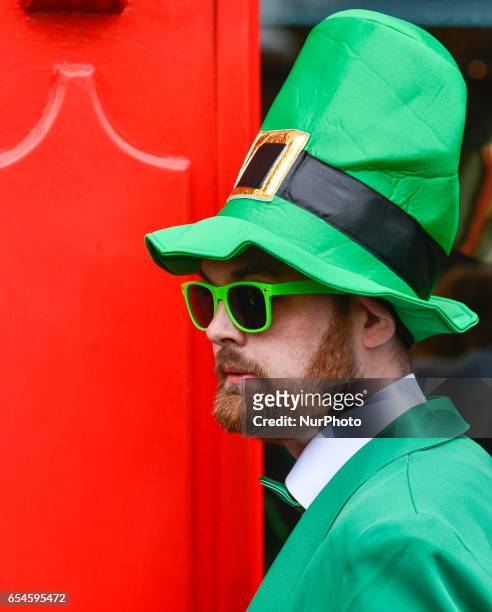People celebrate St Patrick's Day 2017 during the parade in Dublin's city center. This year edition of St Patrick's Festival takes place from March...