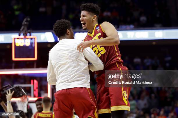 Bennie Boatwright of the USC Trojans celebrates with a teammate after defeating the Southern Methodist Mustangs during the first round of the 2017...