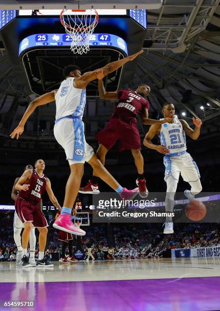 Seventh Woods of the North Carolina Tar Heels blocks a shot by Demontrae Jefferson of the Texas Southern Tigers in the first half during the first...