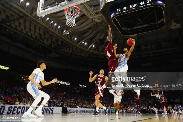 Joel Berry II of the North Carolina Tar Heels goes up for a shot against Lamont Walker of the Texas Southern Tigers in the first half during the...