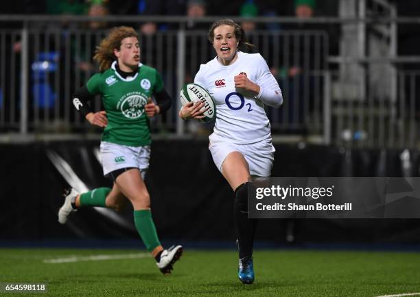 Emily Scarratt of England runs in her team's fourth try during the Women's Six Nations match between Ireland and England at Donnybrook Stadium on...