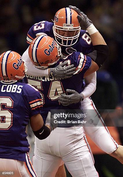 Tight end Kirk Wells of the Florida Gators gets congratulated after scoring a touchdown untouched by the Miami Hurricanes during the first quarter of...