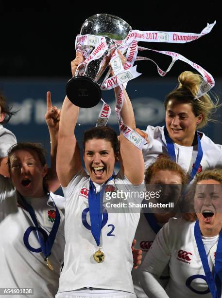 Captain Sarah Hunter of England and the England players celebrate with the trophy after winning the Grand Slam during the Women's Six Nations match...