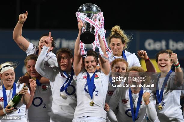 Captain Sarah Hunter of England and the England players celebrate with the trophy after winning the Grand Slam during the Women's Six Nations match...