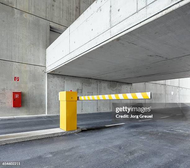 boom barrier in car park - boundaries imagens e fotografias de stock