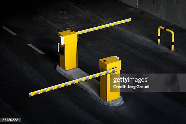 boom barriers in car park - boundaries imagens e fotografias de stock