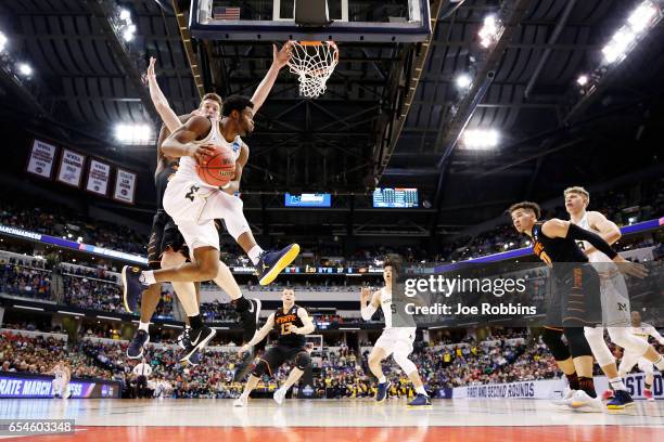 Derrick Walton Jr. #10 of the Michigan Wolverines drives to the basket against the Oklahoma State Cowboys during the first round of the 2017 NCAA...