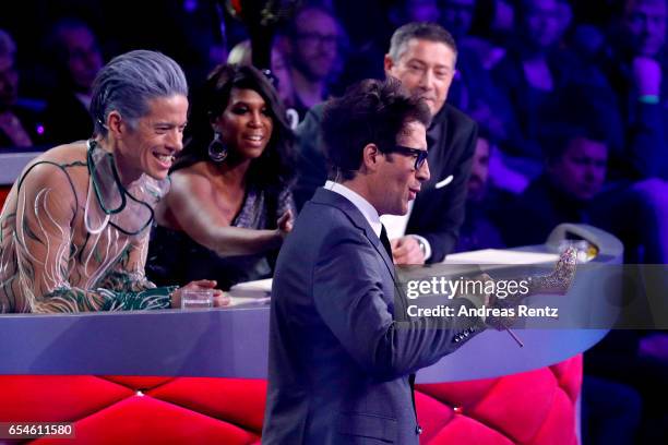 Host Daniel Hartwich talks about Sylvie Meis' shoes with the members of the jury Jorge Gonzalez, Motsi Mabuse and Joachim Llambi during the 1st show...