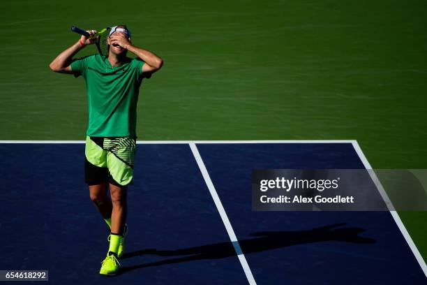 Jack Sock of the United States reacts to a point during a match against Kei Nishikori of Japan in the men's quarterfinals match on Day 12 during the...