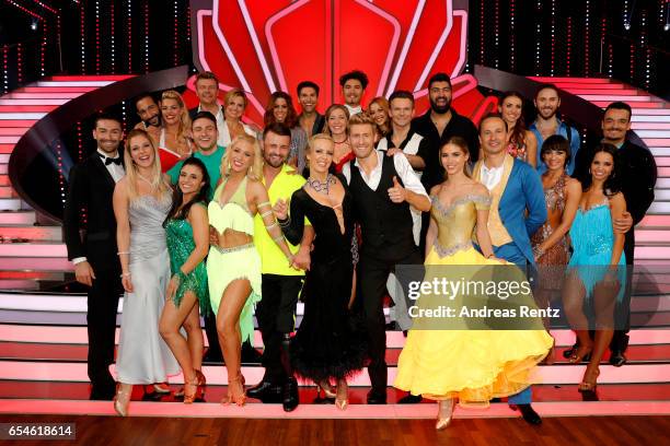 All participants pose for a group photo after the 1st show of the tenth season of the television competition 'Let's Dance' on March 17, 2017 in...