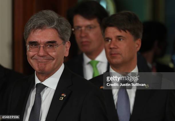 Siemens President and CEO Joe Kaeser and BMW CEO Harald Krueger arrive in the East Room of the White House ahead of a joint news conference with U.S....