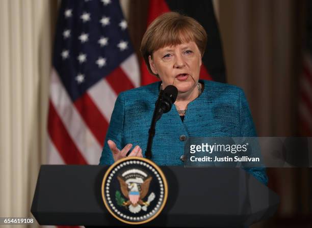 German Chancellor Angela Merkel speaks during a joint press conference with U.S. President Donald Trump in the East Room of the White House on March...