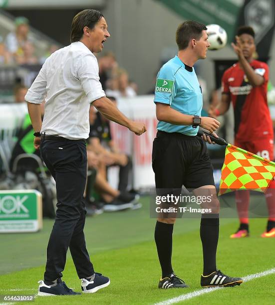 Head coach Roger Schmidt of Leverkusen gestures during the Bundesliga match between Borussia Moenchengladbach and Bayer 04 Leverkusen at...