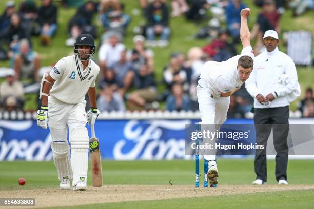 Morne Morkell of South Africa bowls while Jeet Raval of New Zealand and umpire Kumar Dharmasena of Sri Lanka look on during day three of the test...