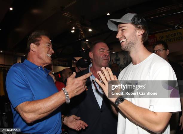 Arnold Schwarzenegger speaks with his son Patrick and event promoter Tony Doherty during the 2017 Arnold Classic at The Melbourne Convention and...