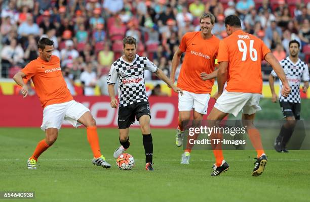 Nowitzki - Vettel, Sebastian Kehl, Sebastian Vettel, Dirk Nowitzki and Lars Riedel battle for the ball duringthe 'Champions for charity' football...