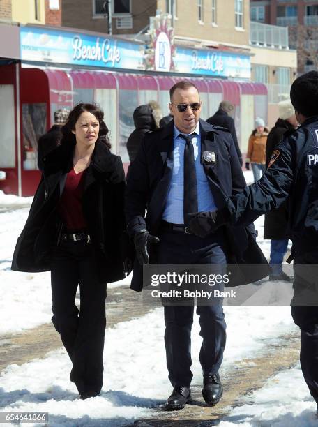 Marisa Ramirez and Donnie Wahlberg are seen filming are seen filming on the set of "Blue Bloods" on March 17, 2017 in Brooklyn.