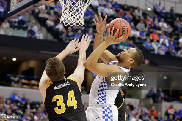 Isaiah Briscoe of the Kentucky Wildcats shoots the ball against Drew McDonald of the Northern Kentucky Norse in the second half during the first...