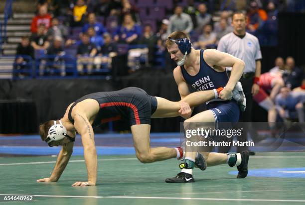 Jason Nolf of the Penn State Nittany Lions scores a takedown against Tyler Berger of the Nebraska Cornhuskers in their semifinal match during session...