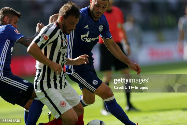 Junior Caicara of Schalke and Szabolcs Huszti of Frankfurt , Sead Kolainac of Schalke battle for the ball during the Bundesliga match between...