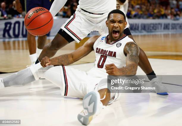 Sindarius Thornwell of the South Carolina Gamecocks celebrates in the second half against the Marquette Golden Eagles during the first round of the...