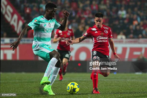 Jorge Djaniny Tavares of Santos fights for the ball with Damian Perez of Tijuana during the 11th round match between Tijuana and Monterrey as part of...