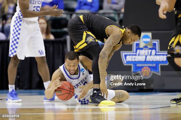 Isaiah Briscoe of the Kentucky Wildcats looks to pass the ball against Jeff Garrett of the Northern Kentucky Norse in the second half during the...