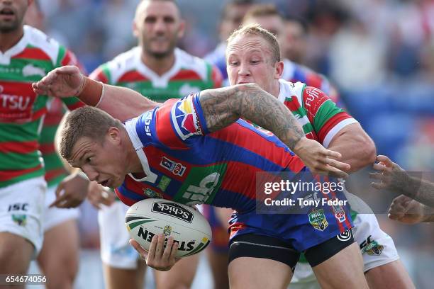 Trent Hodkinson of the Knights scores a try during the round three NRL match between the Newcastle Knights and the South Sydney Rabbitohs at McDonald...