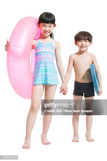 cute children in swimsuit with swim ring - one piece stock pictures, royalty-free photos & images