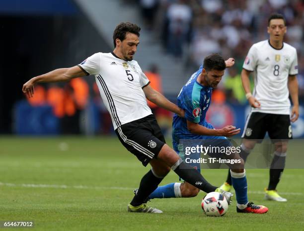 Mats Hummels of Germany and Michal Duris of Slovakia battle for the ball during the UEFA EURO 2016 round of 16 match between Germany and Slovakia at...