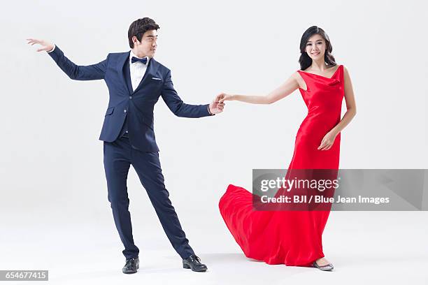 elegant young chinese couple dancing - ballroom dancers stock pictures, royalty-free photos & images