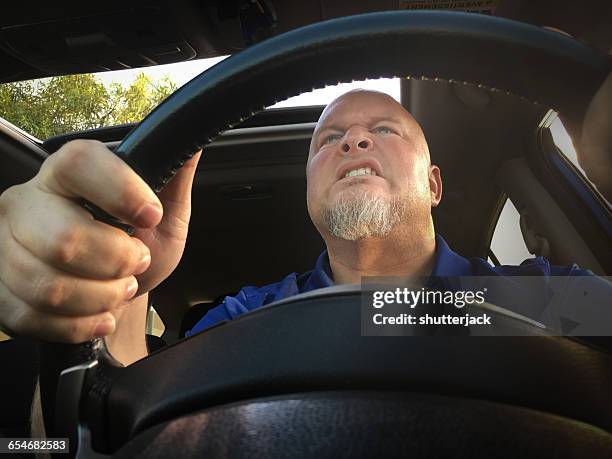 man with road rage driving - road rage stock pictures, royalty-free photos & images