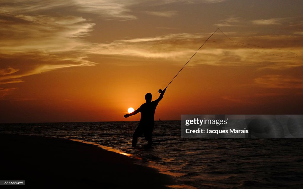 Man fishing at sunset near Inhaca Island, Maputo, Mozambique, Africa