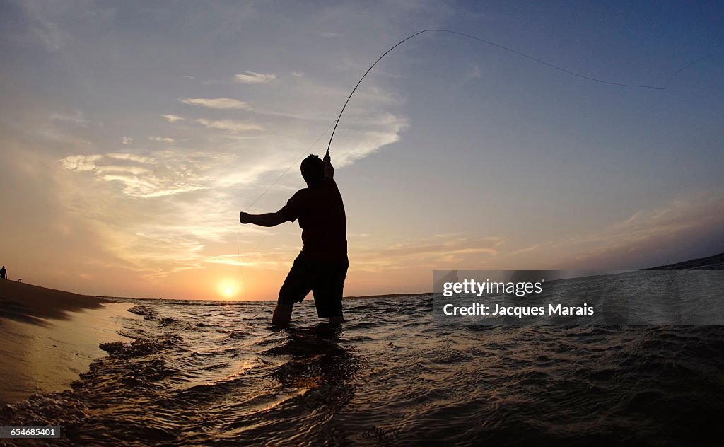 Man fishing at sunset near Inhaca Island, Maputo, Mozambique, Africa