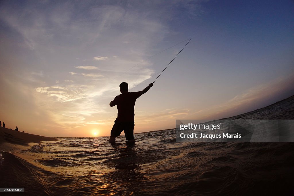 Man fishing at sunset near Inhaca Island, Maputo, Mozambique, Africa