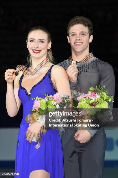 Rachel Parsons and Michael Parsons of the USA pose with their gold medals during the 4th day of the World Junior Figure Skating Championships at...