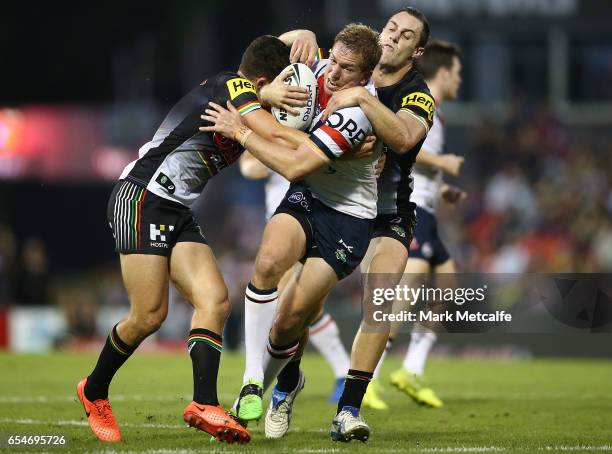 Mitchell Aubusson of the Roosters is tackled during the round three NRL match between the Penrith Panthers and the Sydney Roosters at Pepper Stadium...