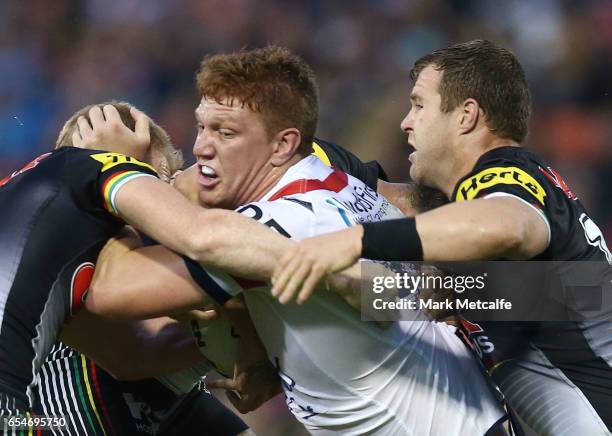 Dylan Napa of the Roosters is tackled during the round three NRL match between the Penrith Panthers and the Sydney Roosters at Pepper Stadium on...