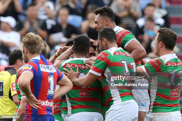 Rabbitohs players celebrte during the round three NRL match between the Newcastle Knights and the South Sydney Rabbitohs at McDonald Jones Stadium on...