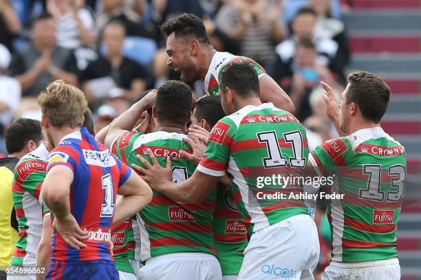 Rabbitohs players celebrte during the round three NRL match between the Newcastle Knights and the South Sydney Rabbitohs at McDonald Jones Stadium on...