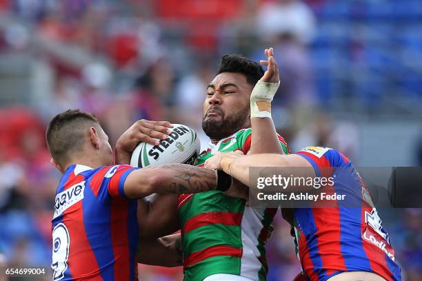 Zane Musgrove of the Rabbitohs is tackled by the Knights defence during the round three NRL match between the Newcastle Knights and the South Sydney...