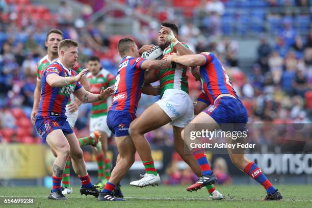 Zane Musgrove of the Rabbitohs is tackled by the Knights defence during the round three NRL match between the Newcastle Knights and the South Sydney...