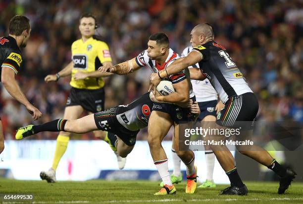 Ryan Matterson of the Roosters is tackled during the round three NRL match between the Penrith Panthers and the Sydney Roosters at Pepper Stadium on...