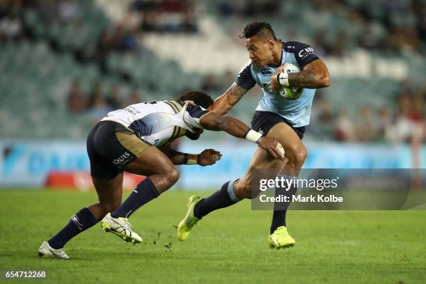 Henry Speight of the Brumbies tackles Israel Folau of the Waratahs during the round four Super Rugby match between the Waratahs and the Brumbies at...