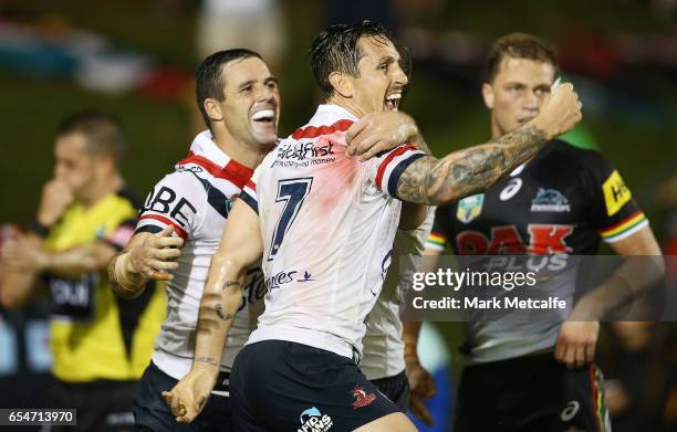 Michael Gordon of the Roosters celebrates scoring a try with team mate Mitchell Pearce during the round three NRL match between the Penrith Panthers...