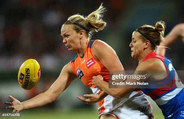 Phoebe McWilliams of the Giants is tackled by Hannah Scott of the Bulldogs during the round seven AFL Women's match between the Greater Western...