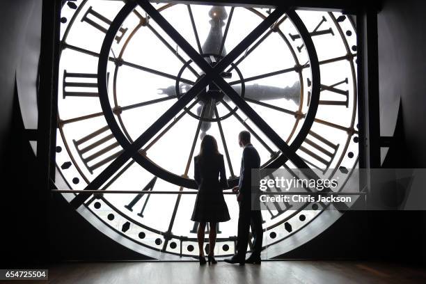 Catherine, Duchess of Cambridge and Prince William, Duke of Cambridge look through the clock at Musee d'Orsay during an official two-day visit to...