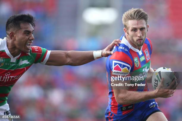 Brendan Elliot of the Knights is tackled during the round three NRL match between the Newcastle Knights and the South Sydney Rabbitohs at McDonald...